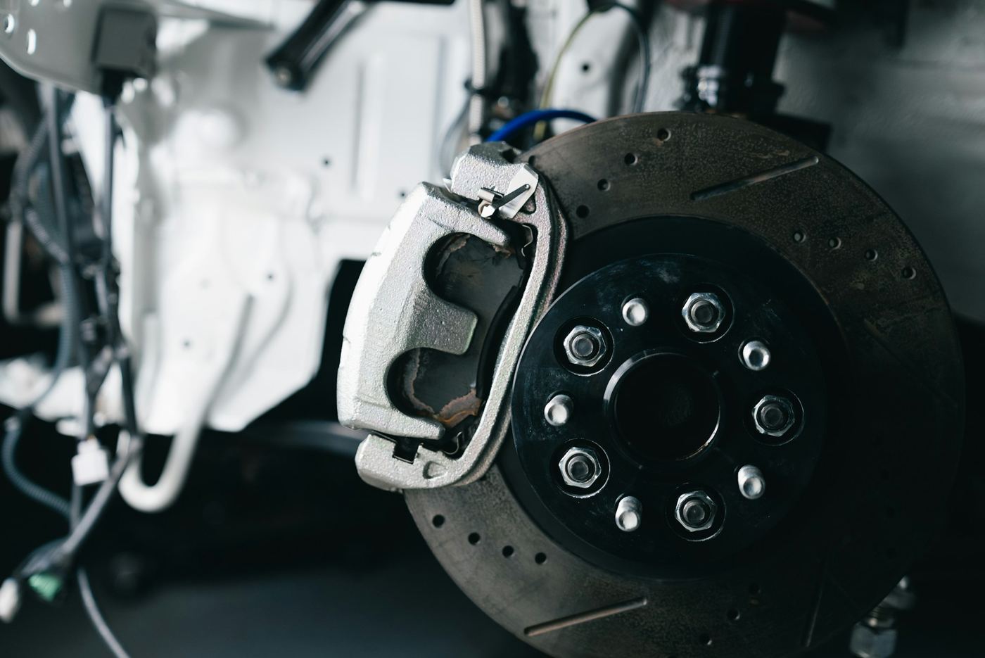 Close-up of a car brake rotor and caliper