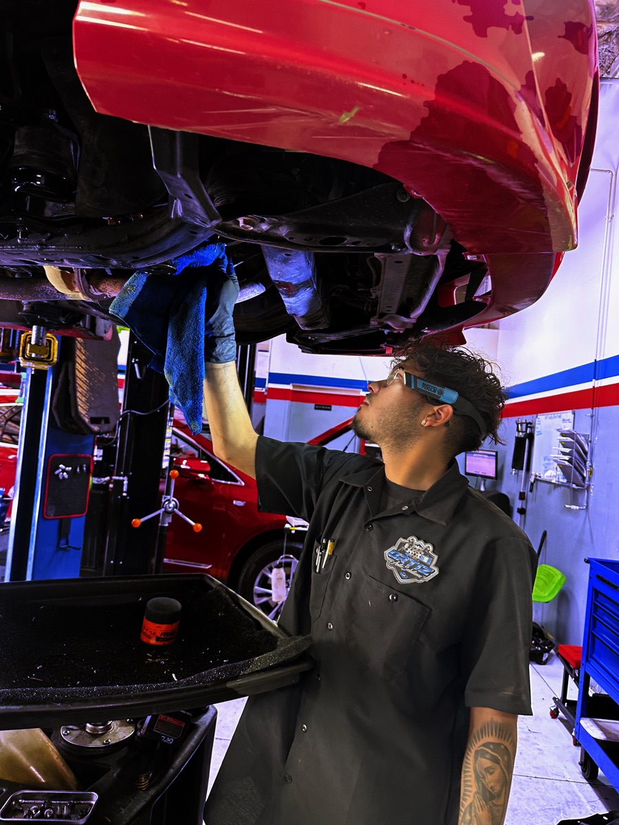 Ortiz Auto Solutions technician performing an oil change in the Las Vegas shop
